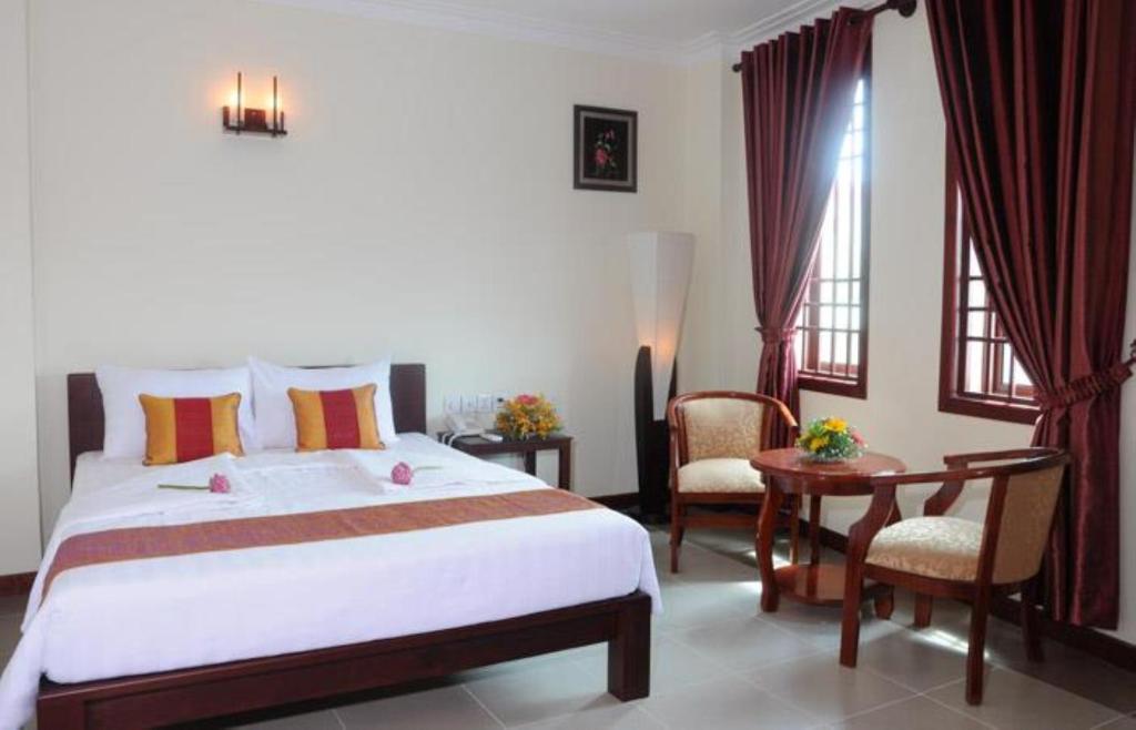 V N E Hotel Phnom Penh Habitación foto